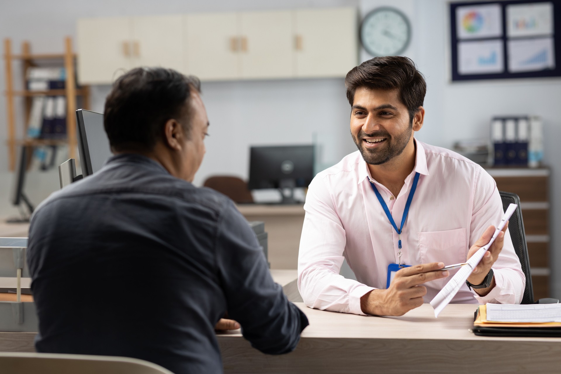 Customer with bank manager in office stock photo